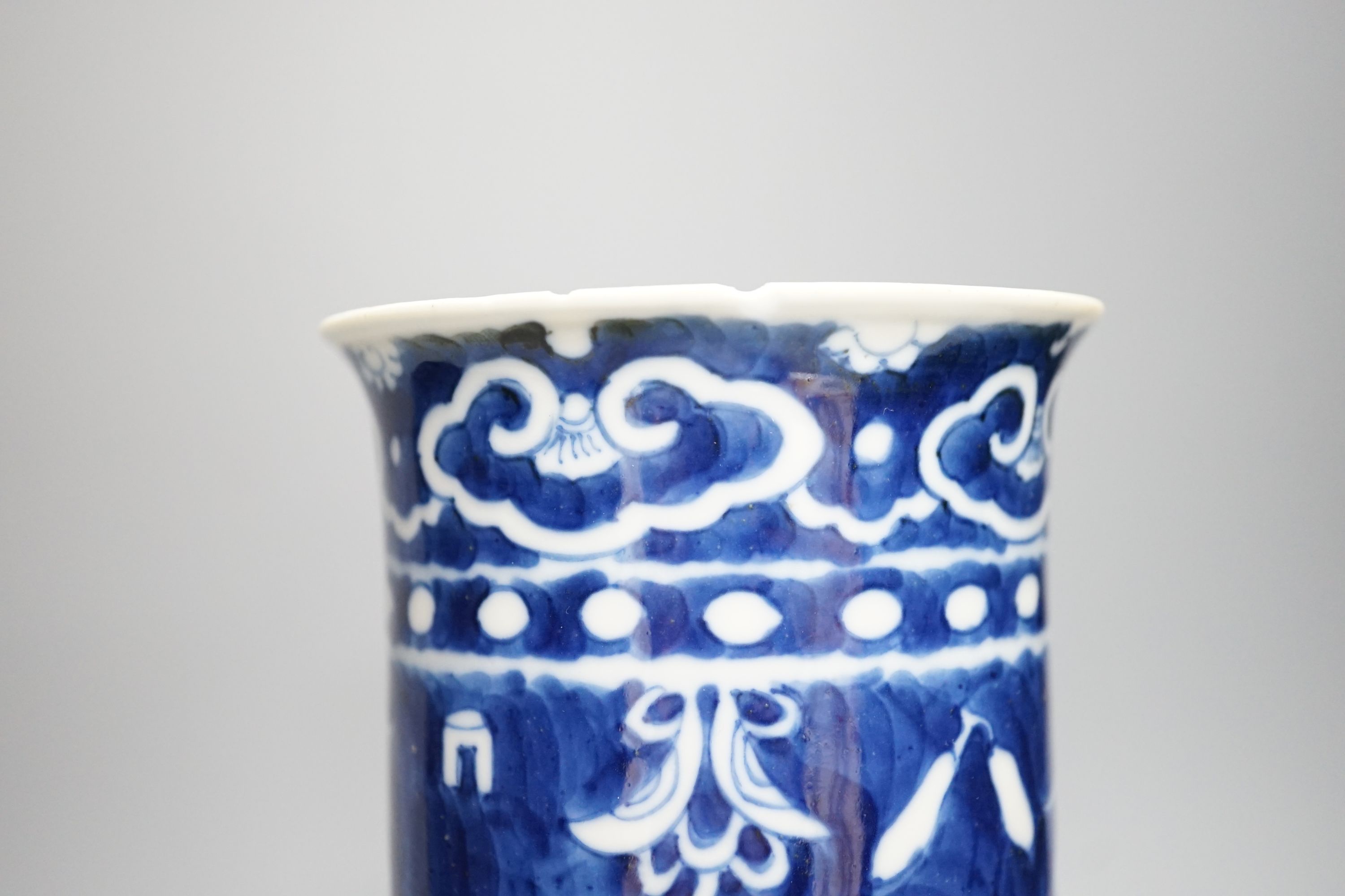 A Chinese blue and white sleeve vase and small famille rose vase, sleeve vase 25 cms high.